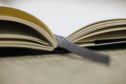 Note book with fabric bookmark. Stock Photos