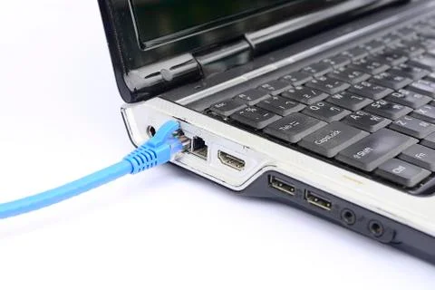Note book with network cable Stock Photos