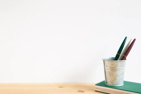 Note book with pen on table with white background. Work and study place 写真素材