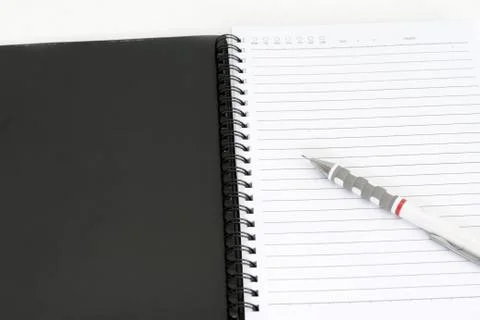 Note book with pencil Stock Photos