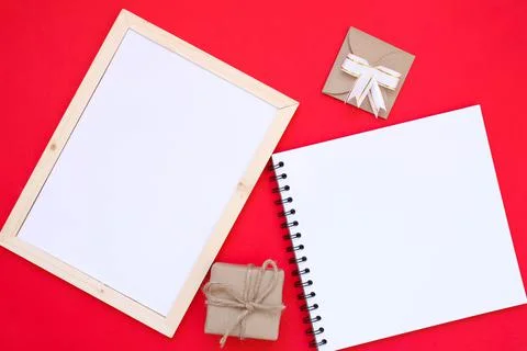 Note book on red background for Christmas concept. Stock Photos