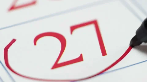 A note on the calendar, the twenty-seventh number, significant date close up Stock Footage 99158076