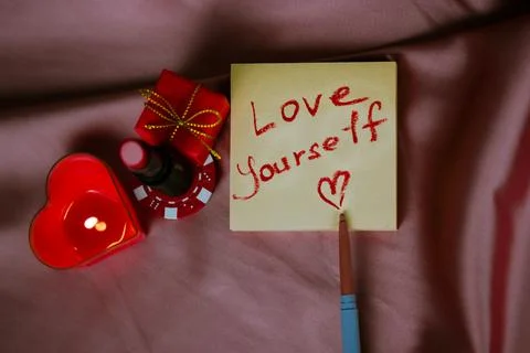 A note with a call to love yourself drawing with red lipstick. Valentines Day Stock Photos