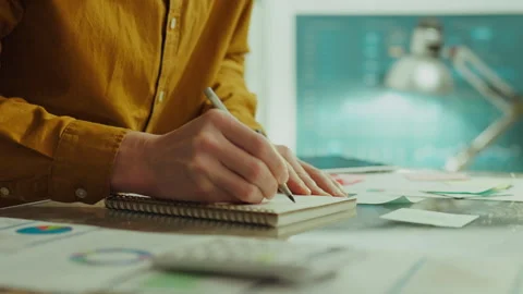 Note. Corporate analyst in office clothes generate business ideas in corpora Stock Footage 263657306