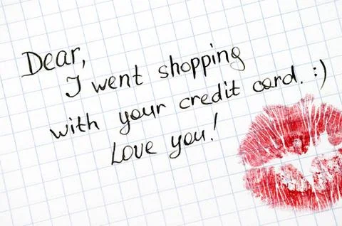 Note - Dear, I went shopping with your credit card. Love you! with kiss on pa Stock Photos