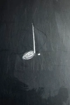 The note is drawn on a black chalk board Foto stock