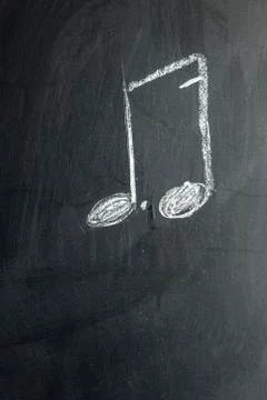 The note is drawn on a black chalk board Foto stock