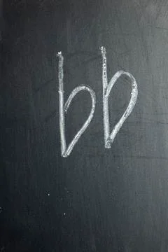 The note is drawn on a black chalk board Foto stock