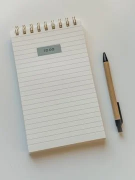 Note pad clean page with to do list sticker and pen close up Stock Photos