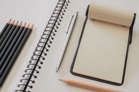 Note Pad with Colored Pencils Stock Photos