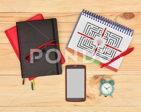 Note pad with drawing maze Stock Photos