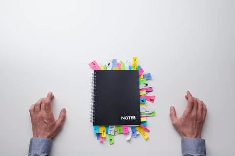 Note pad full of post it notes from above Stock Photos