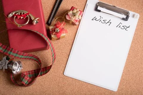 Note pad with word wish list with holiday decoration on wood table Stock Photos