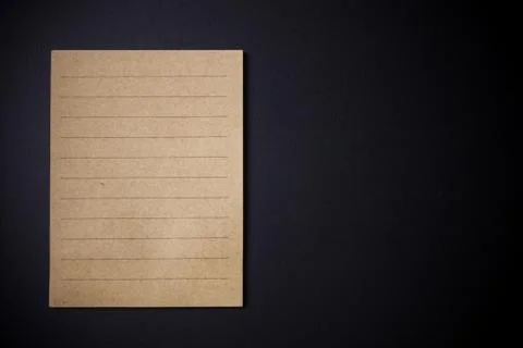 Note paper on black background. Stock Photos