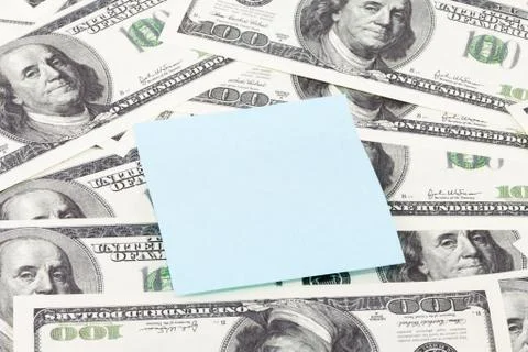Note paper on dollars background Stock Photos