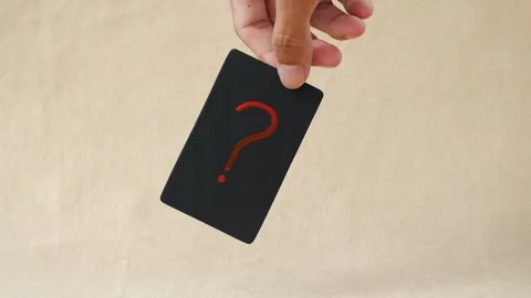 Note paper in hand holds paper with a question mark Stock Footage 268912317