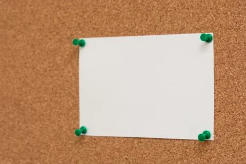 Note paper swith push pins on cork board. Empty paper pages for notes copy sp Stock-Fotos