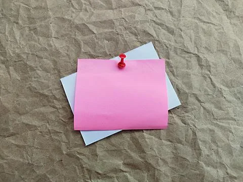 Note paper with tacks and crumpled gray paper background. Space for text Stock Photos