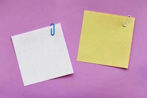 Note papers label with clip on purple background Stock Photos