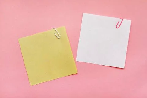 Note papers label with clips on the pink background Stock Photos