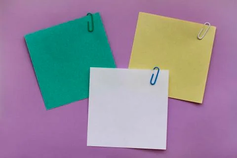 Note papers label with clips on purple background Stock Photos