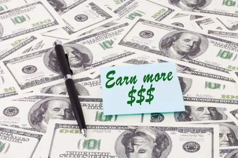 Note with pen on dollars Stock Photos