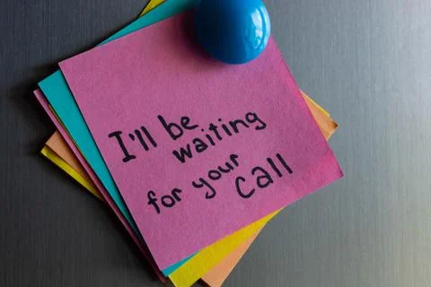 A note on the refrigerator waiting for call. Stock Photos