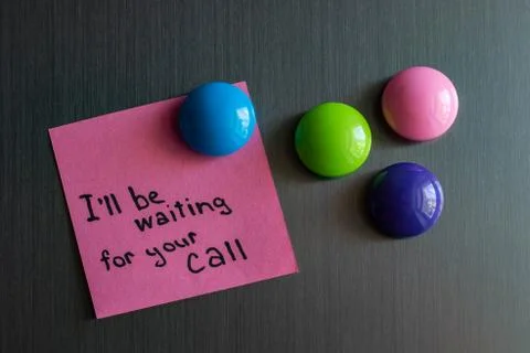 A note on the refrigerator waiting for call. Stock Photos