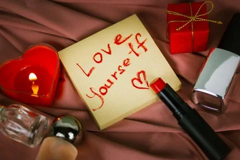 A note to self with call to love yourself drawing with red lipstick Stock Photos