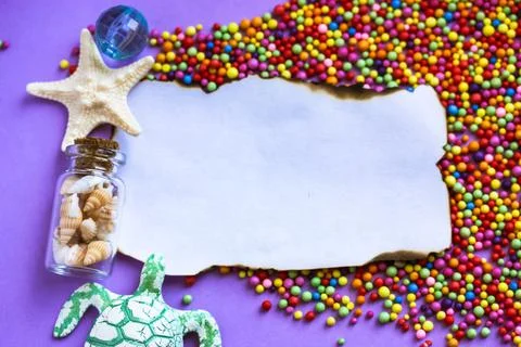 Note with starfish, turtle, seashell bottle flatly. A paper page burnt edges. Stock Photos