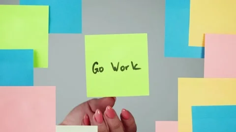 Note sticker on transparent glass close-up. Working in office, creative designer Stock Footage 181999774