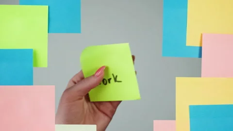 Note sticker on transparent glass close-up. Working in office, creative designer Stock Footage 182008257