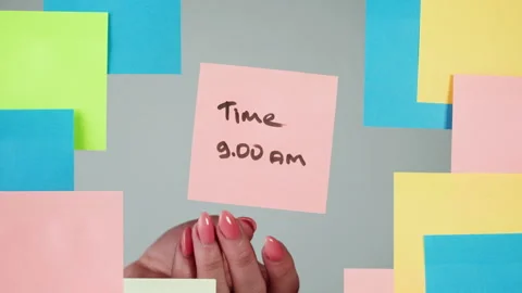 Note sticker on transparent glass close-up. Working in office, creative designer Stock Footage 182009540