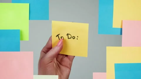 Note sticker on transparent glass close-up. Working in office, creative designer Stock Footage 182015091