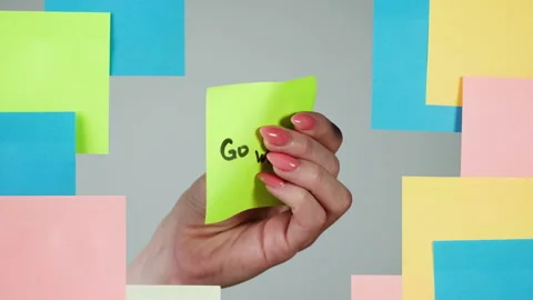Note sticker on transparent glass close-up. Working in office, creative designer Stock Footage 182017928