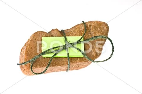 Note tied to rock Stock Photos