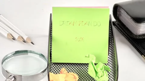A note transitions from scribbles to Dream Plan Do and the year 2026. Pencils Stock Footage 326134738