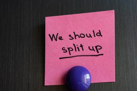 Note we should split up with a magnet attached to the refrigerator. Stock Photos