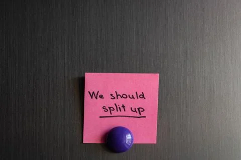 Note we should split up with a magnet attached to the refrigerator. Stock Photos