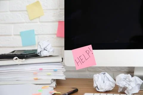 Note with word Help and stationery on computer at workplace Stock Photos