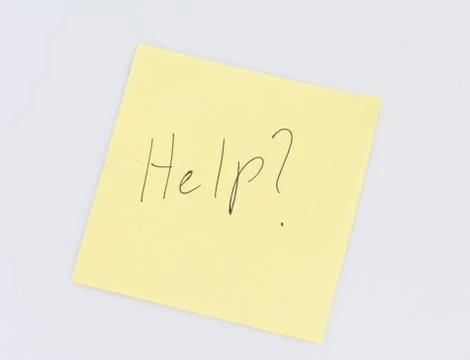 Note with the word Help written on it Stock Photos