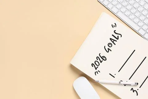 Notebook with 2026 goals and computer keyboard on beige background Stock Photos