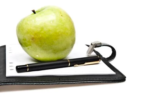 Notebook and apple Stock Photos