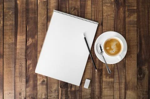 Notebook and coffee cup Stock Photos