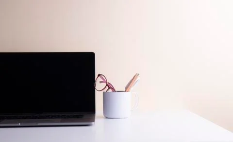 Notebook and the coffee cup on the table Stock Photos