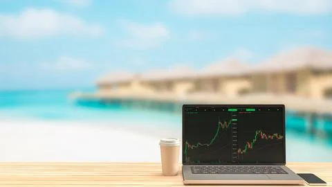 Notebook and coffee cup workspace outdoor on the beach for business concept.. Stock Photos