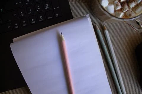 Notebook and coffee on the desktop Stock Photos