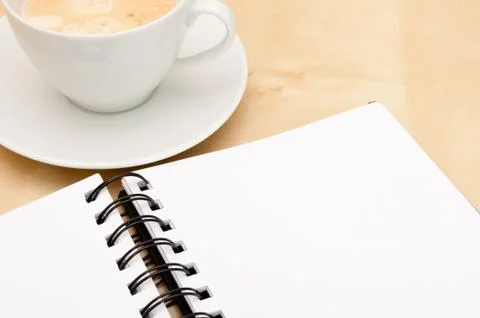 Notebook and coffee Stock Photos