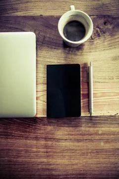 Notebook and a cup of coffee Stock Photos