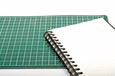 Notebook and cutting mat Stock Photos